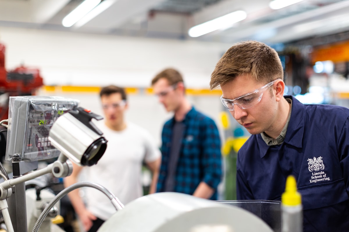 Technicians inspecting equipment at an industrial facility